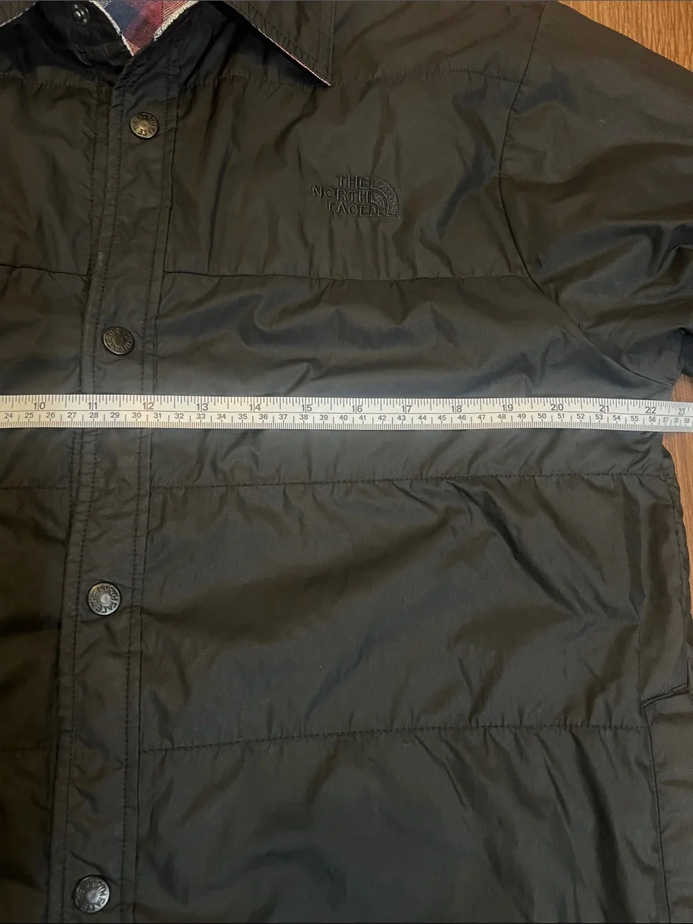 The North Face Black Jacket with Red & Blue Plaid Lining can be worn inside-out